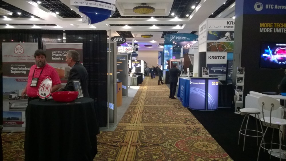 Exhibition hall after it opened. Note the booths in the foreground are regular size. The ones from NG, Boeing, LockMar, and others are huge. Thank you taxpayers for lucrative contracts!!